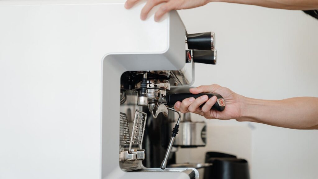 man-fixing-coffee-machine