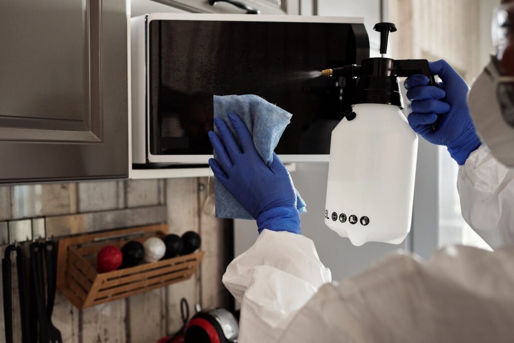 woman-cleaning-microwave