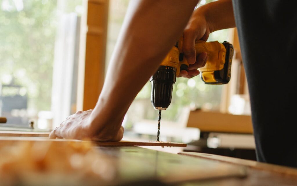 man-drilling-plywood