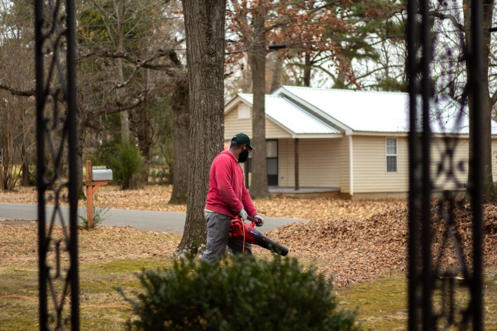 man-using-leaf-blower-to-blow-leaves