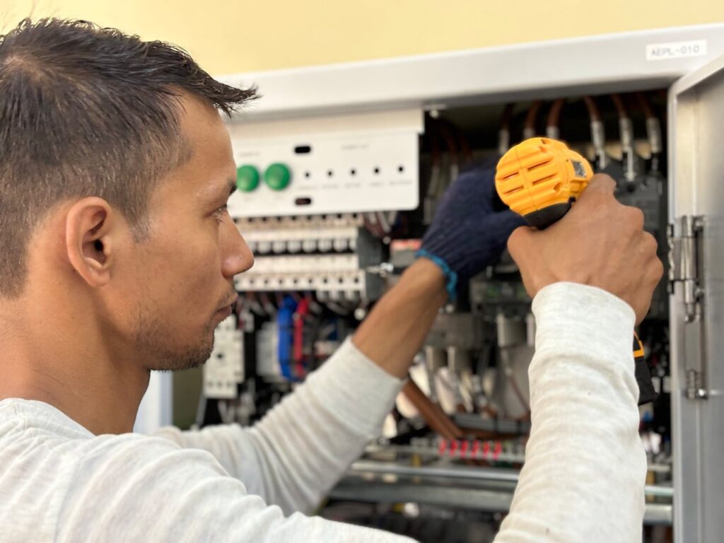 man-repairing-appliance