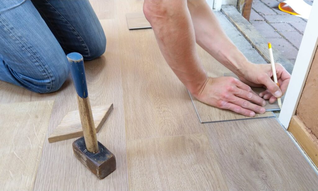 man-measuring-flooring